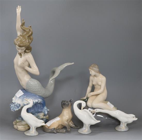 A Lladro figure of a mermaid, three geese, a Copenhagen mermaid and cat tallest 42cm